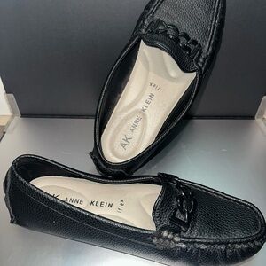 Anne Klein Black Pebbled Leather Slip-On Loafers with Chain Accent